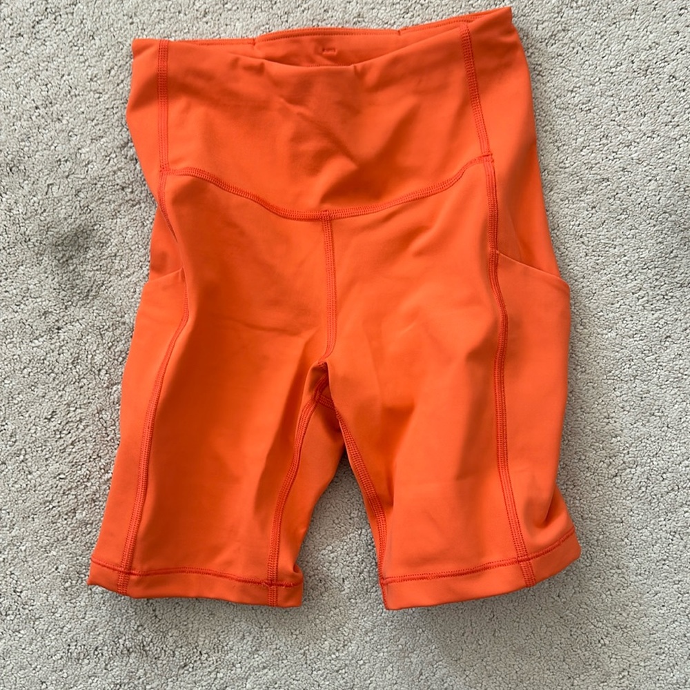 Athleta orange biker shorts